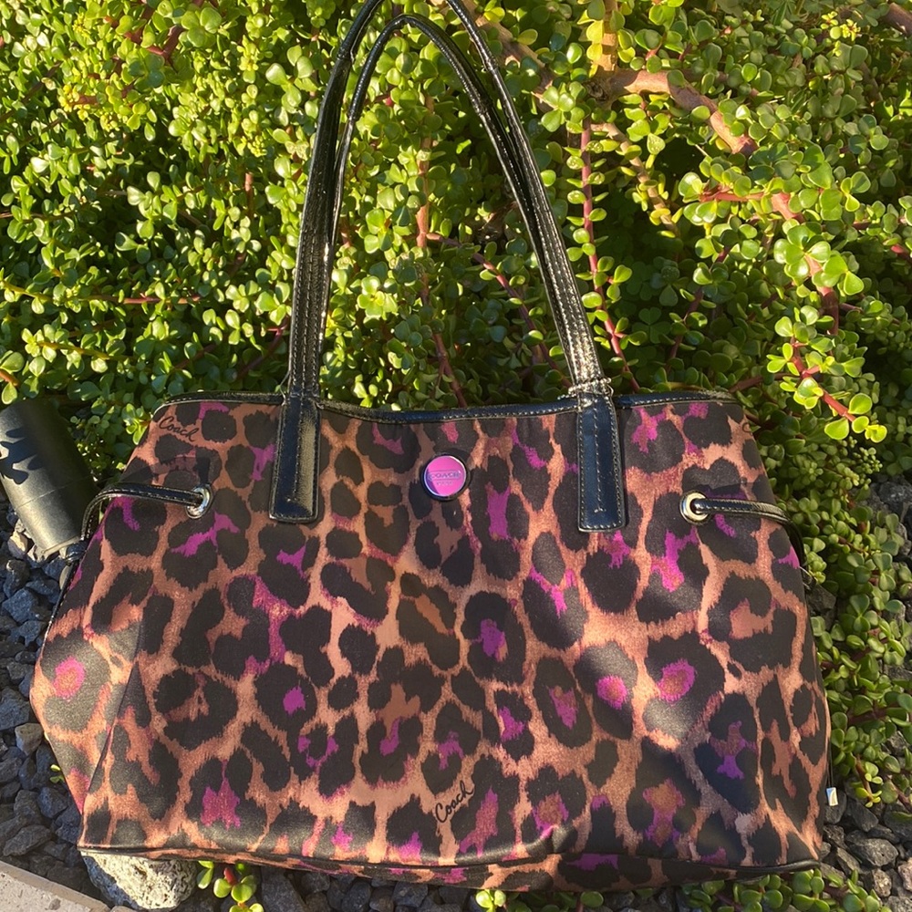 Slightly used Coach with tears by the handles .. see pictures Please